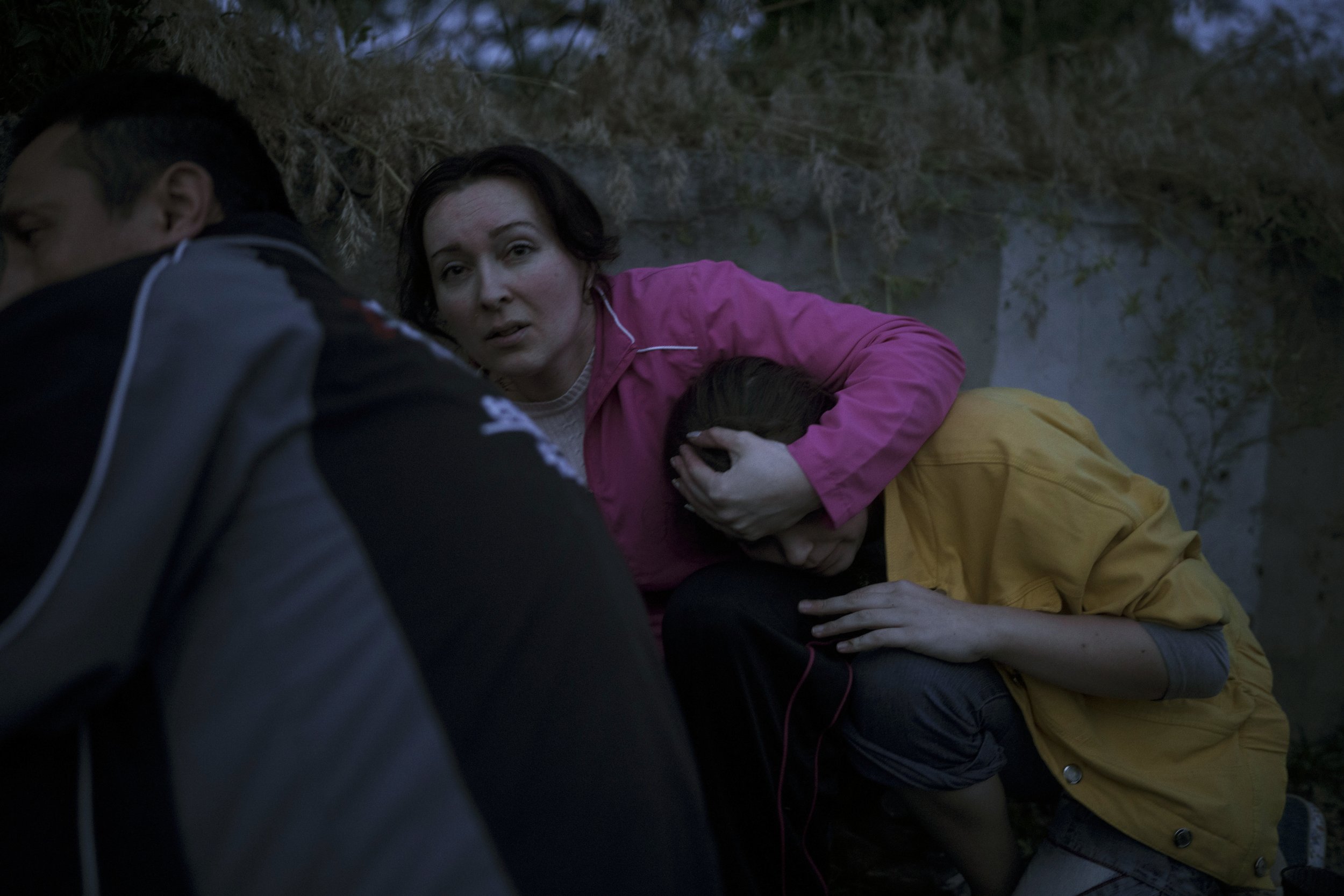  Iryna Sokeryna holds her daughter, Liubov, as they take cover from Russian shelling while being evacuated from a neighborhood in Kherson, Ukraine, that was flooded after the Kakhovka dam blew up overnight, on June 6, 2023. (AP Photo/Felipe Dana) 