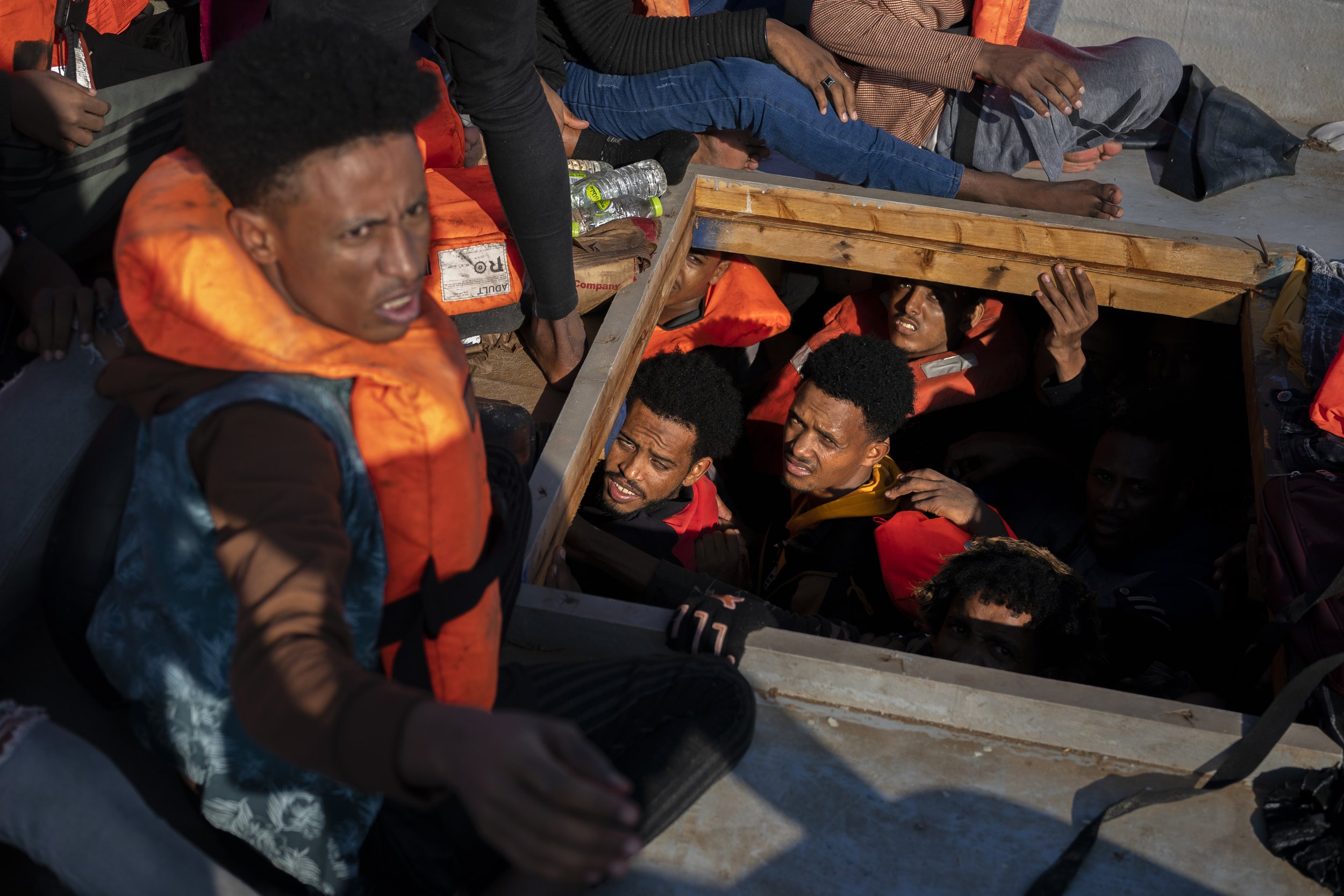  Migrants from Eritrea, Libya and Sudan are crowded in the hold of a wooden boat before being assisted by aid workers of the Spanish NGO Open Arms, in the Mediterranean sea, about 30 miles north of Libya on June 17, 2023. (AP Photo/Joan Mateu Parra) 