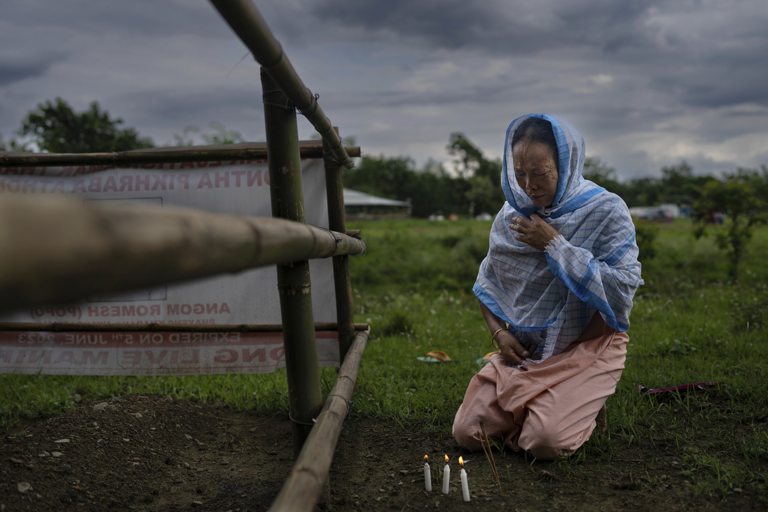  Lilapati Devi, from the Hindu majority Meitei community, sobs on June 22, 2023, as she visits the grave of her husband, A. Ramesh Singh, who was killed by Kukis at his home in the village of Phayeng, near Imphal, the capital of the northeastern Indi