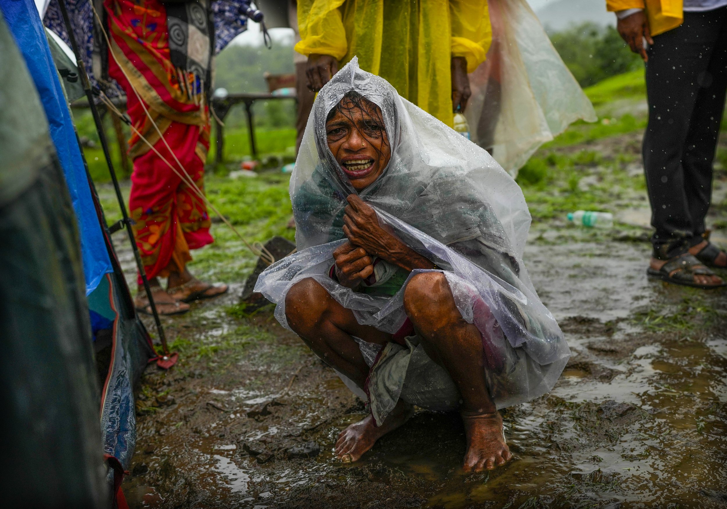  A woman whose family members are trapped under rubble wails after a landslide washed away houses in Raigad district, western Maharashtra state, India, on July 20, 2023. (AP Photo/Rafiq Maqbool) 