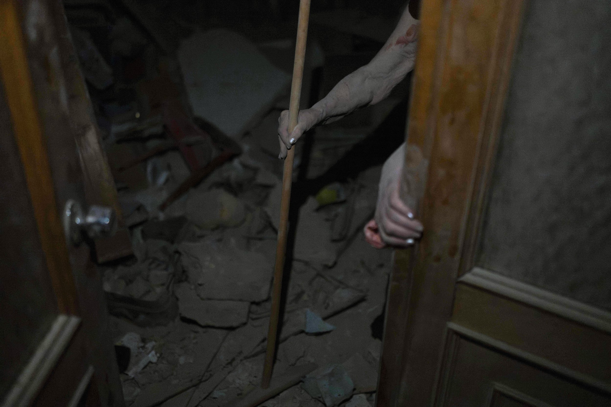  An elderly woman walks out of her apartment destroyed in Russian missile attacks in Odesa, Ukraine, on July 23, 2023. (AP Photo/Jae C. Hong) 