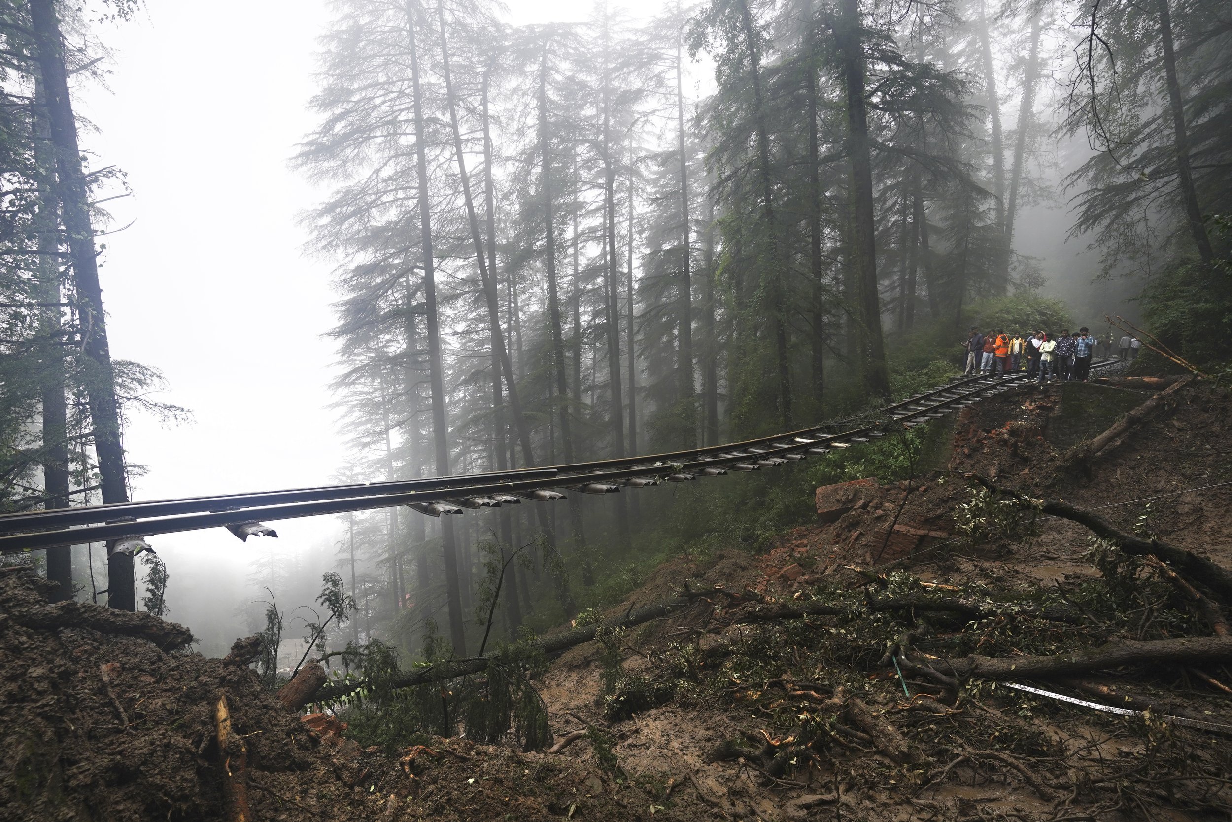  A portion of the Shimla-Kalka heritage railway track dangles above ground that was washed away following heavy rainfall on the outskirts of Shimla, Himachal Pradesh state, in India's Himalayan region on Aug. 14, 2023. (AP Photo/ Pradeep Kumar) 