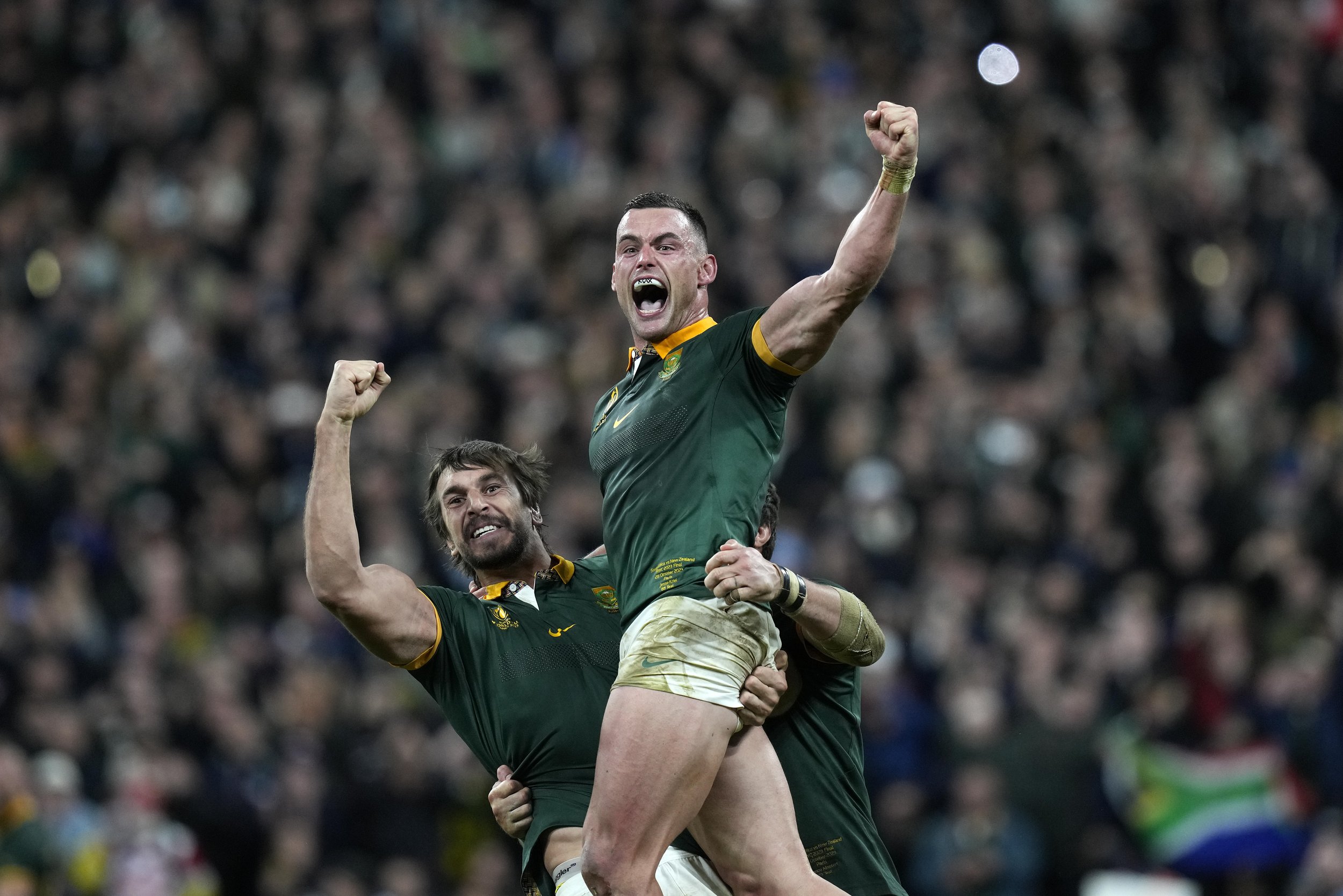  South Africa's Jesse Kriel, right, and Eben Etzebeth celebrate after winning the Rugby World Cup final match against New Zealand at the Stade de France in Saint-Denis, near Paris, on Oct. 28, 2023. (AP Photo/Thibault Camus) 