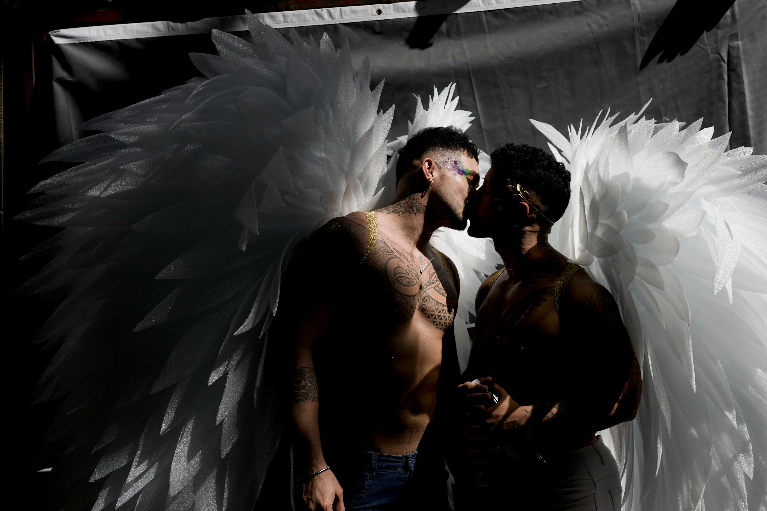  Men donning angel wings share a kiss in downtown Buenos Aires, Argentina, where thousands gathered to commemorate the 32nd annual Pride Parade on Nov. 4, 2023. (AP Photo/Rodrigo Abd) 