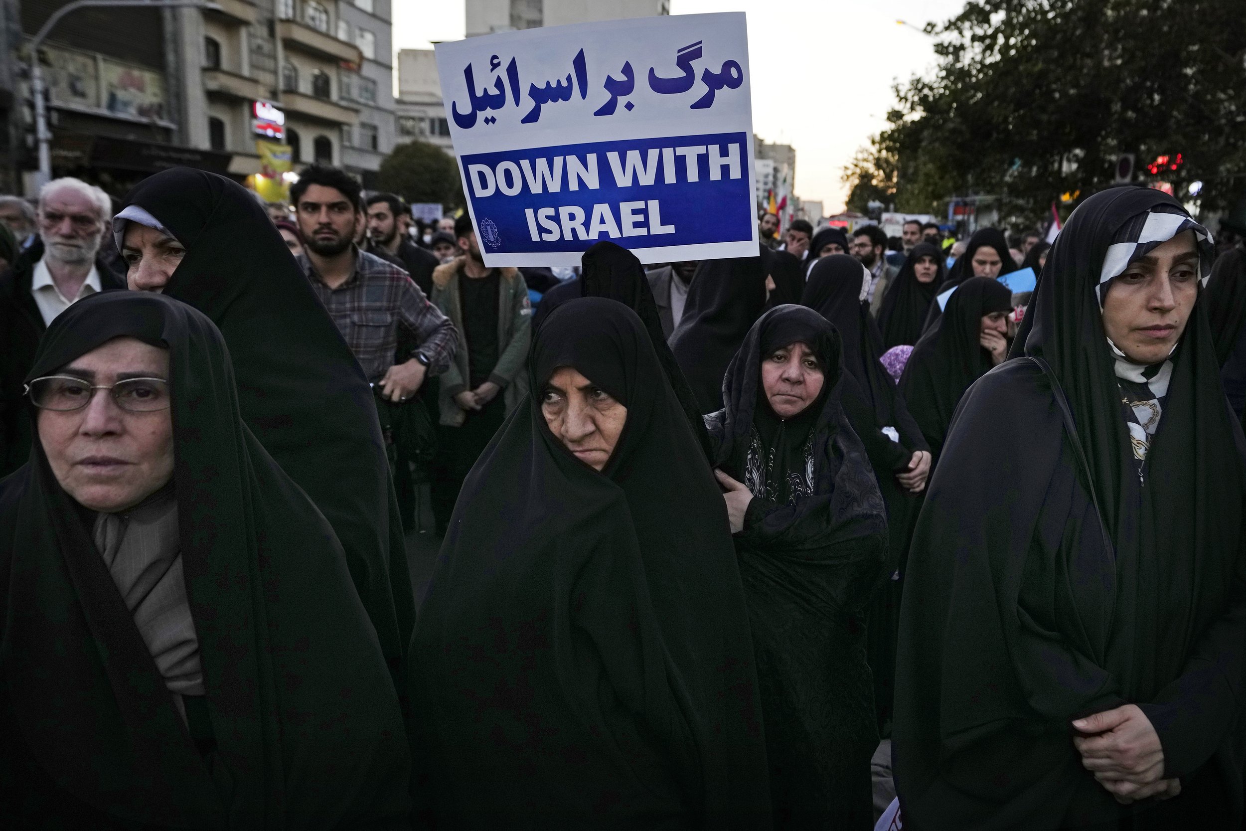  An Iranian demonstrator holds an anti-Israel placard during a pro-Palestinian rally at Enqelab-e-Eslami (Islamic Revolution) Square in Tehran, Iran, on Nov. 18, 2023. (AP Photo/Vahid Salemi) 