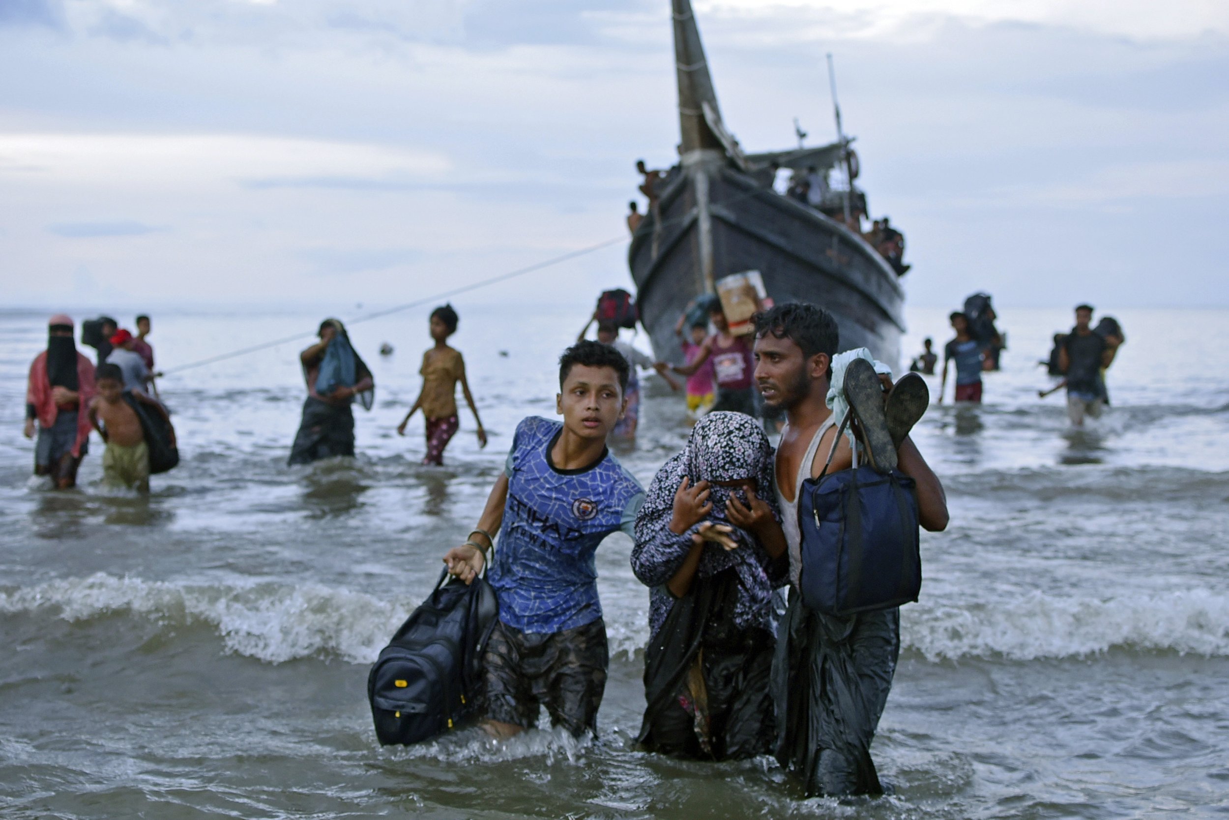  Ethnic Rohingya disembark from their boat upon landing in Ulee Madon, on the north coast of Sumatra, Indonesia, on Nov. 16, 2023. Some 240 Rohingya Muslims, including women and children, made two attempts to land but were rejected by local residents
