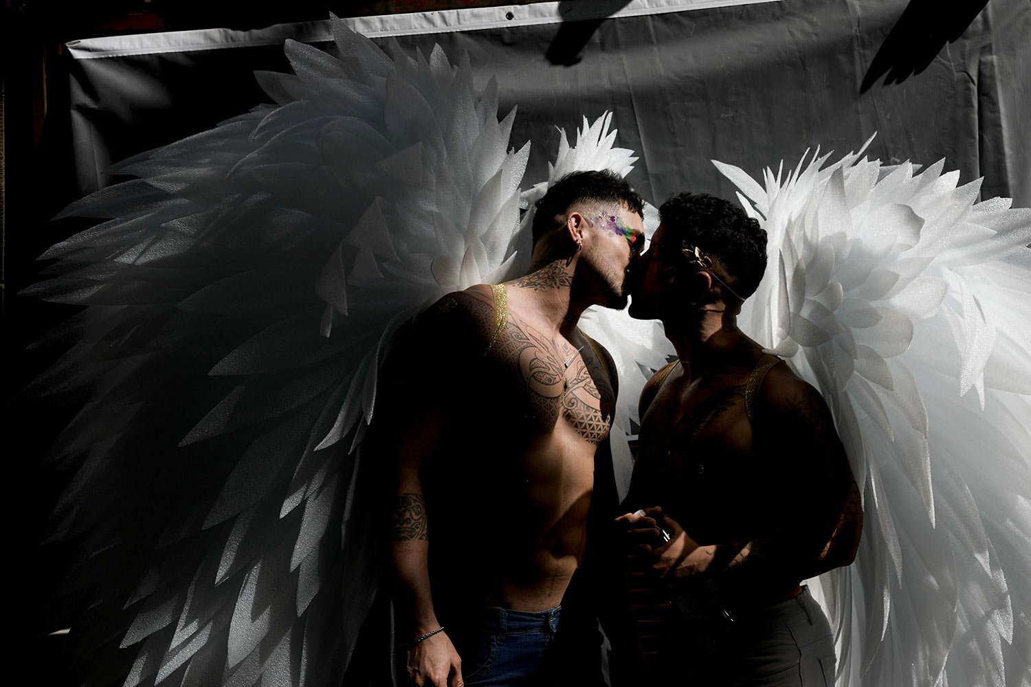  Men donning angel wings share a kiss in downtown Buenos Aires, Argentina, Nov. 4, 2023, where thousands gathered to commemorate the 32nd annual Pride Parade. (AP Photo/Rodrigo Abd) 