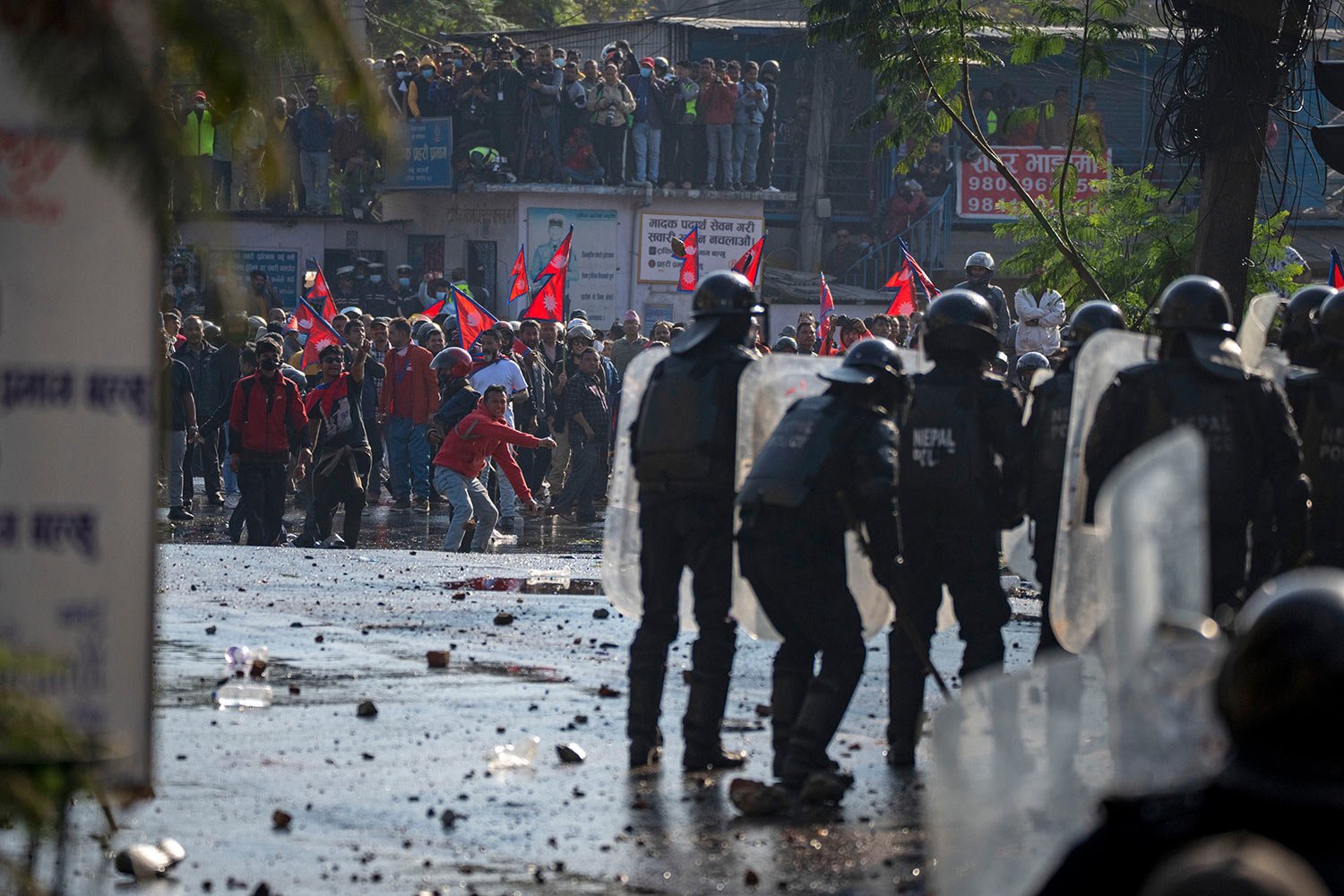  Protesters clash with police in a rally demanding a restoration of Nepal's monarchy in Kathmandu, Nepal, Thursday, Nov. 23, 2023. (AP Photo/Niranjan Shrestha) 