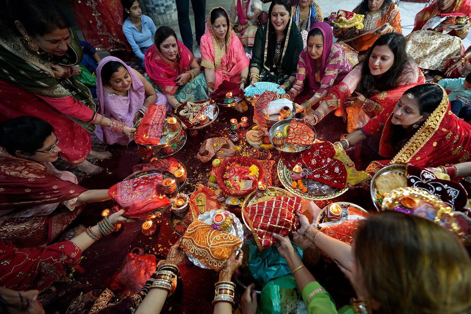  Married Hindu women perform rituals to pray for the longevity and well-being of their husbands during Karva Chauth festival in Jammu, India, Thursday, Nov. 1, 2023. (AP Photo/Channi Anand) 