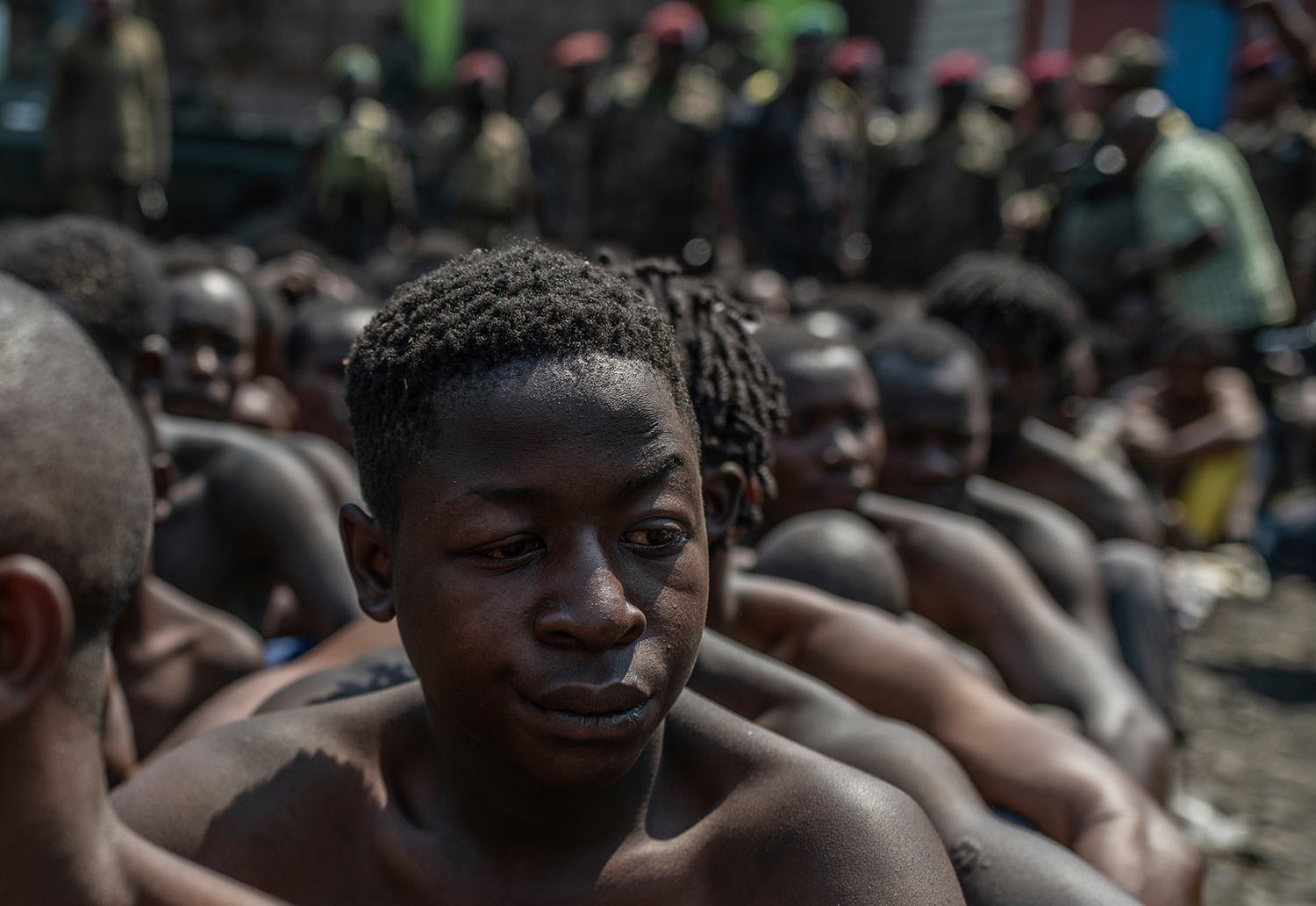  Arrested members of the Wazalendo sect are sat and lined up in Goma, Democratic Republic of the Congo, Wednesday, Aug. 30, 2023.  (AP Photo/Moses Sawasawa) 