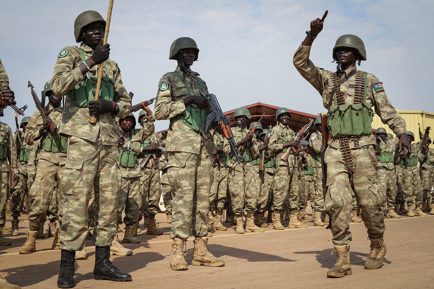  Soldiers from the South Sudan People's Defence Forces (SSPDF) prepare to board a flight to transport them to eastern Congo, where they are due to operate as part of the East Africa Community Regional Force (EACRF), at the airport in Juba, South Suda