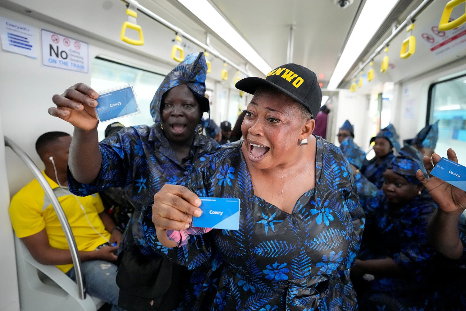  People sing as the ride on a new Lagos blue line train service in Lagos, Nigeria, Monday, Sept. 4, 2023. (AP Photo/Sunday Alamba) 