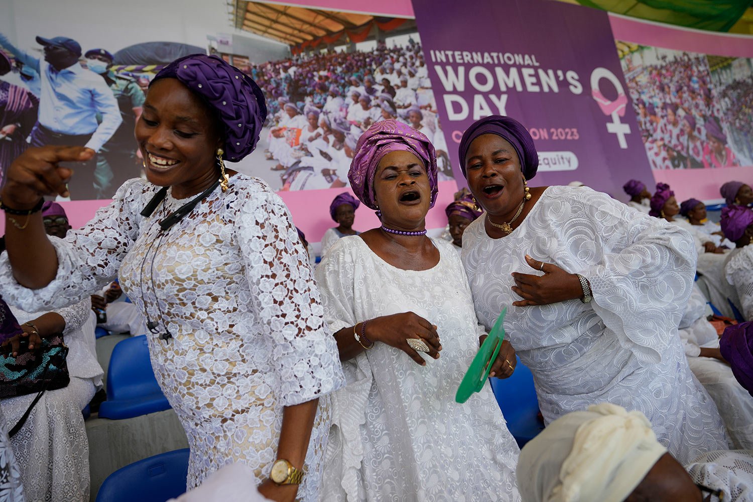  Women sing and dance during the International Women's Day celebration at the Mobolaji Johnson Stadium in Lagos, Nigeria, Wednesday, March 8, 2023. (AP Photo/Sunday Alamba) 