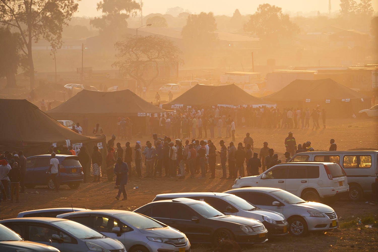  Voters wait in a queue to cast their votes at a polling station in Harare, Wednesday, Aug. 23 2023.  (AP Photo/Tsvangirayi Mukwazhi) 