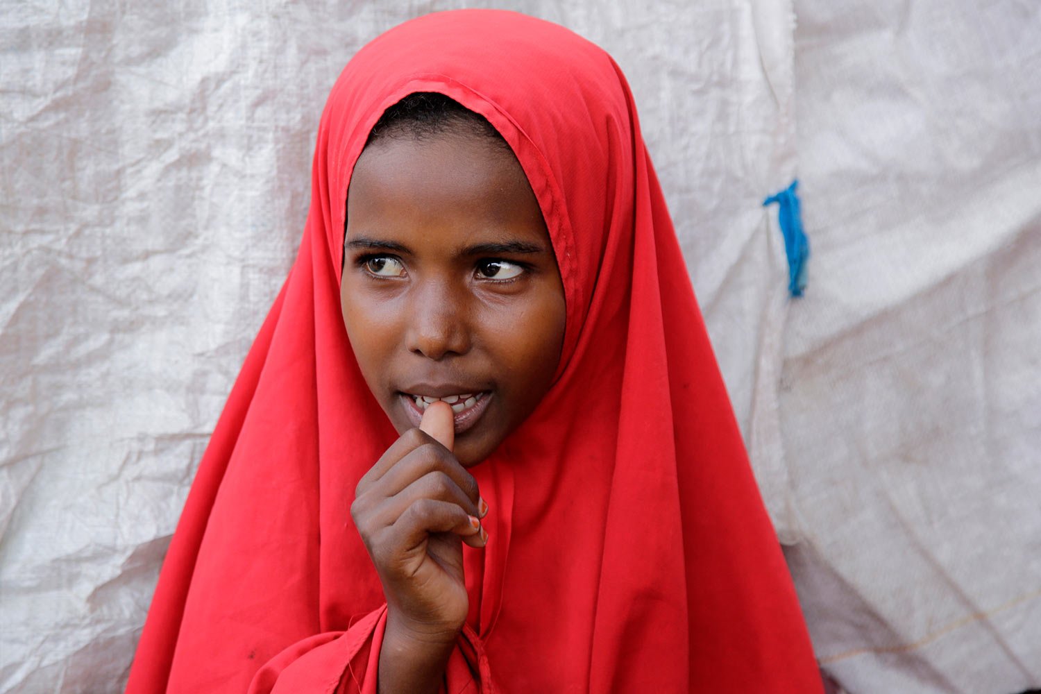 Shukri Mohamed Ibrahim, who fled amid a drought with her family, stands in a makeshift camp for displaced people, on the outskirts of Mogadishu, Somalia, on Thursday, Sept. 28, 2023. (AP Photo/Farah Abdi Warsameh) 