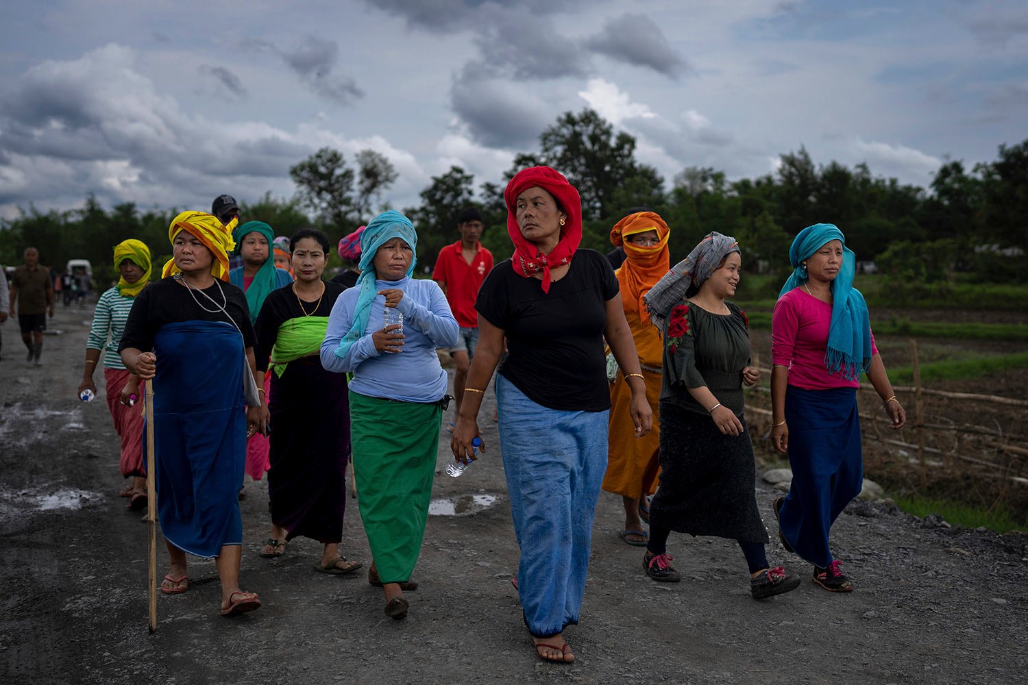  Members of Meira Paibis, powerful vigilante group of Hindu majority Meitei women, march toward the site of a gunfight in Kangchup, near Imphal, capital of the northeastern Indian state of Manipur, Thursday, Jun 22, 2023. (AP Photo/Altaf Qadri) 