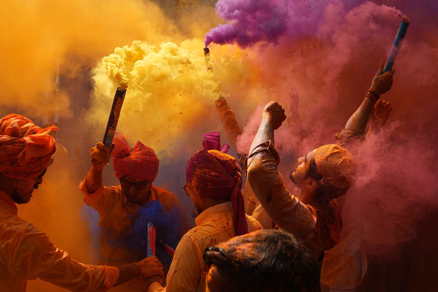  People dance and throw colors at each other to celebrate Holi, the Hindu festival of colours, in Hyderabad, India, Monday, March 6, 2023. (AP Photo/Mahesh Kumar A.) 