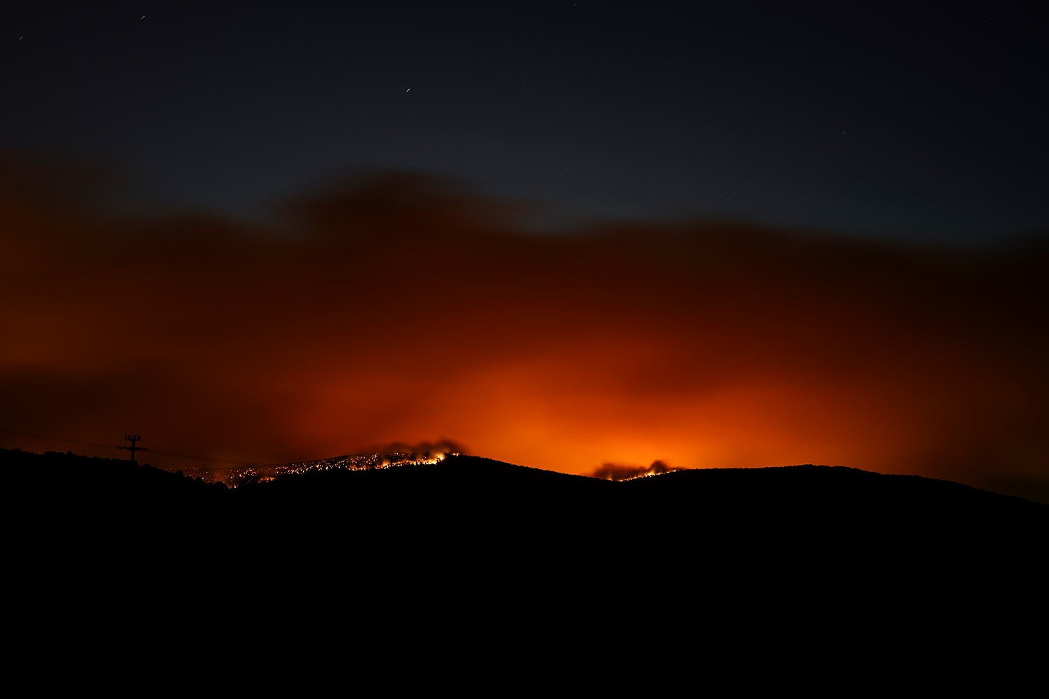  Fire burns in a forest in Dervenohoria, northwest of Athens, early Tuesday, July 18, 2023. (AP Photo/Petros Giannakouris) 