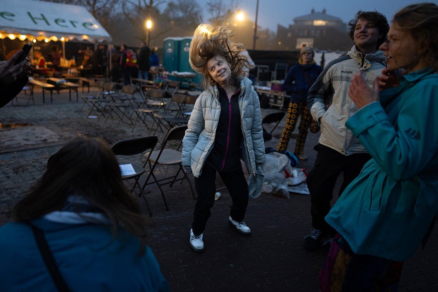  Climate activist Greta Thunberg dances after addressing tens of thousands of people who marched through Amsterdam, Netherlands, Sunday, Nov. 12, 2023, to call for more action to tackle climate change. (AP Photo/Peter Dejong) 