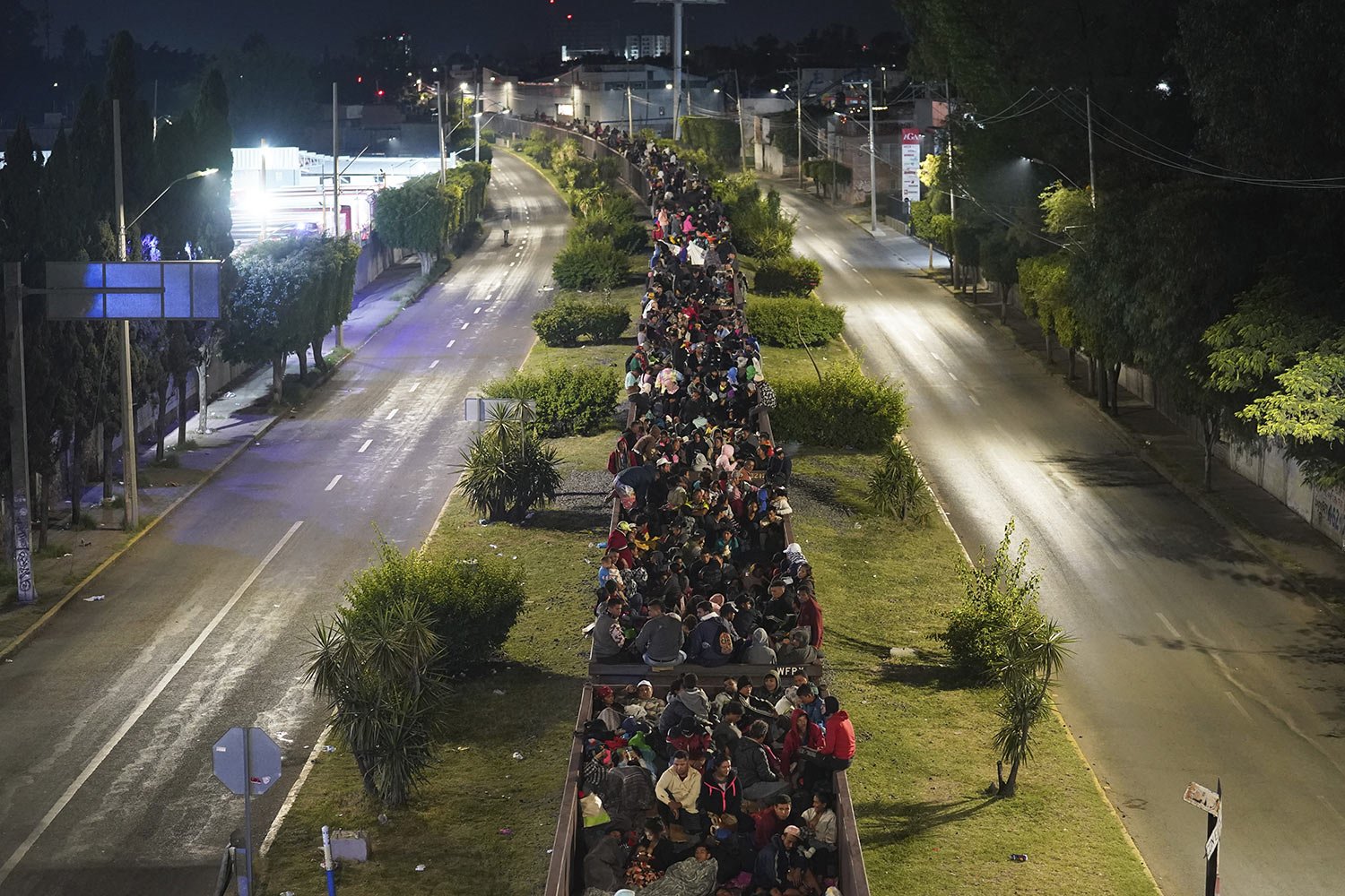  Migrants fill the top of a northbound freight train in Irapuato, Mexico, Saturday, Sept. 23, 2023. Thousands of other migrants were stranded in other parts of the country after Mexico’s biggest railroad said it halted 60 freight trains, citing so ma