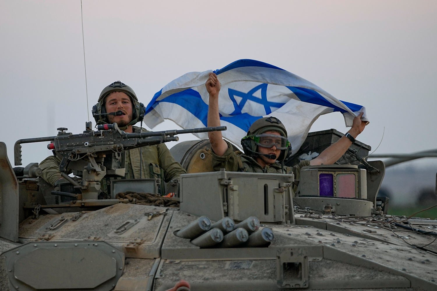  Israeli tanks head towards the Gaza Strip border in southern Israel on Thursday, Oct. 12, 2023. (AP Photo/Ohad Zwigenberg) 