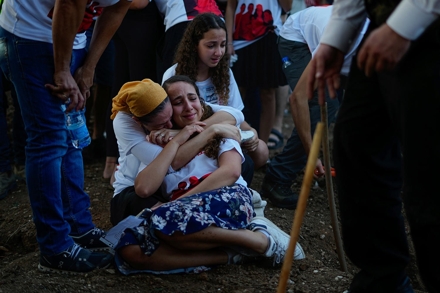  Mourners gather around the graves of British-Israelis Lianne Sharabi and her two daughters, Noiya,16, and Yahel,13, during their funeral in Kfar Harif, Israel, Wednesday, Oct. 25, 2023. Lianne Sharabi and her two daughters were killed by Hamas milit