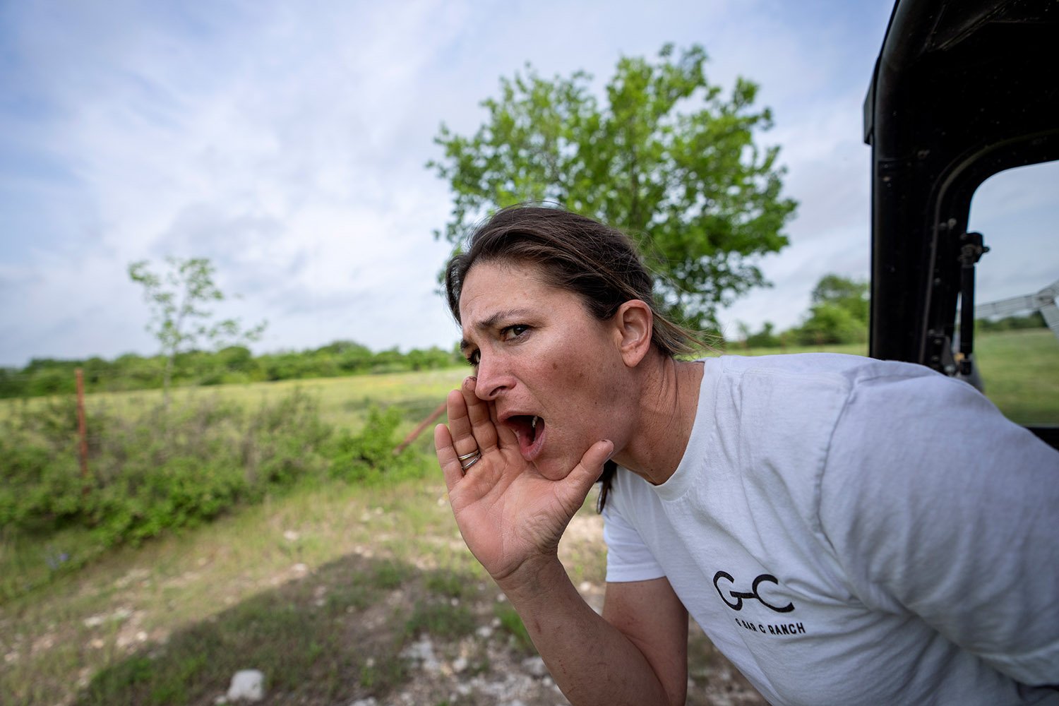  Meredith Ellis calls out to her cattle so they’ll follow her to graze on a different pasture at her ranch in Rosston, Texas, Thursday, April 20, 2023. The cattle part as Ellis edges her small four-wheeler through the herd, silently counting the cows