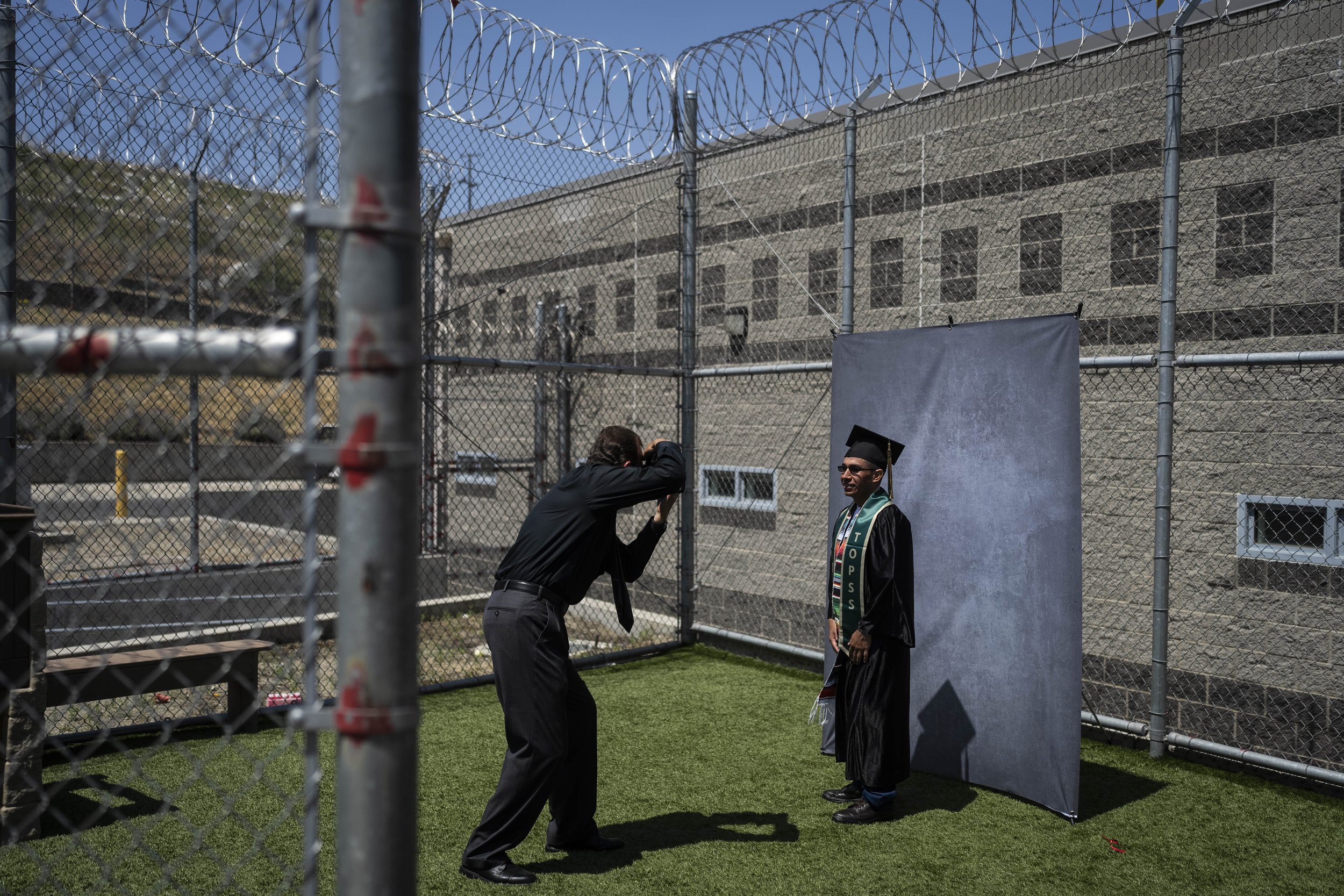  Incarcerated graduate Jose Catalan poses for photos after his graduation ceremony at Folsom State Prison in Folsom, Calif., on May 25, 2023. Catalan earned his bachelor's degree in communications through the Transforming Outcomes Project at Sacramen