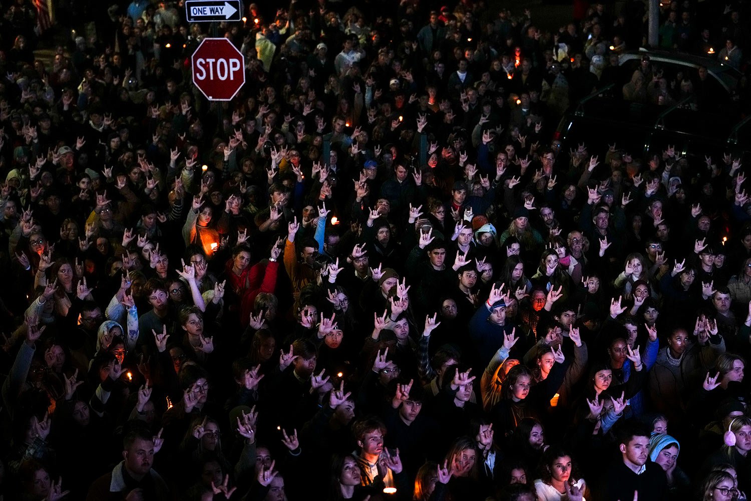  People sign "I love you" while gathered at a vigil for the victims of Wednesday's mass shootings, Sunday, Oct. 29, 2023, outside the Basilica of Saints Peter and Paul in Lewiston, Maine. (AP Photo/Matt Rourke) 