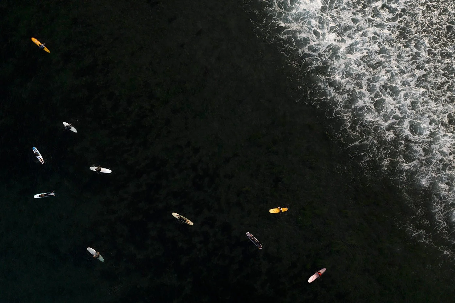  Surfers float in the water while waiting for a wave in Malibu, Calif., on Aug. 31, 2023. (AP Photo/Jae C. Hong) 