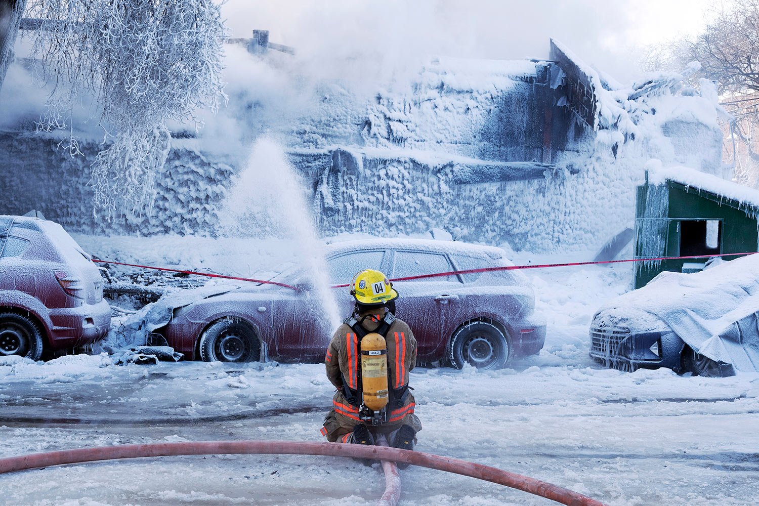  Firefighters battle a five-alarm fire in an apartment building on a frigid winter day in Montreal on Feb. 3, 2023. (Ryan Remiorz/The Canadian Press via AP) 