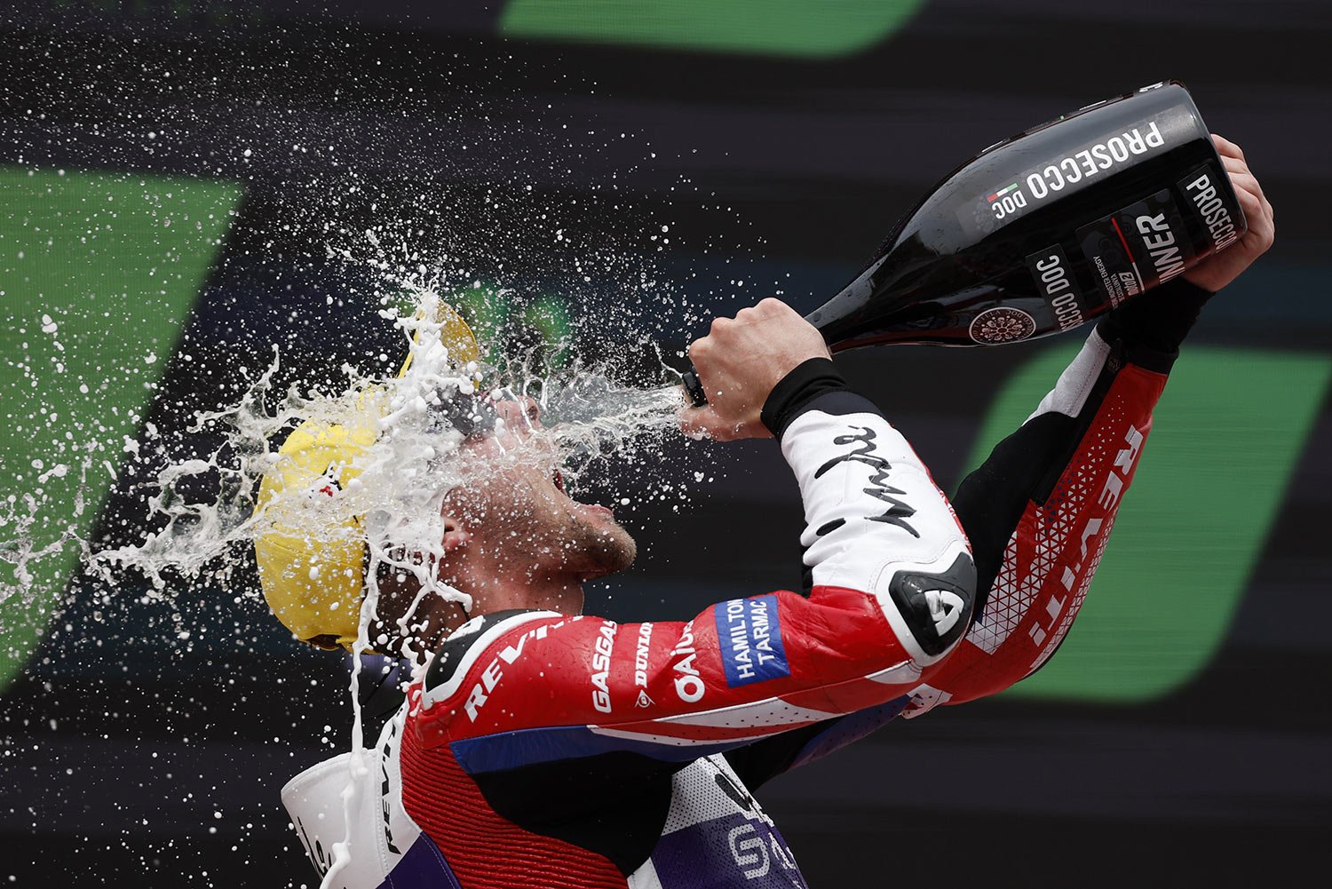  Britain's Moto2 racer Jake Dixon celebrates is victory on the Motorcycle Grand Prix podium at the Catalunya racetrack in Montmelo, just outside of Barcelona, Spain, Sept. 3, 2023. (AP Photo/Joan Monfort) 