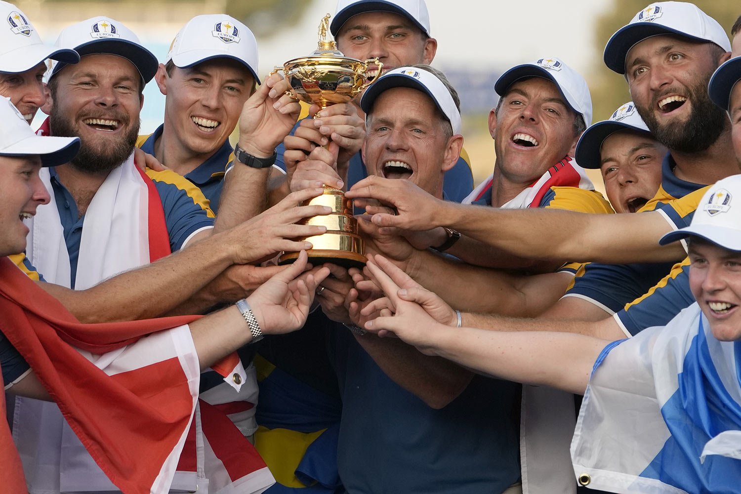  Europe's Team Captain Luke Donald, center, and team members, lift the Ryder Cup after winning it at the Marco Simone Golf Club in Guidonia Montecelio, Italy, Oct. 1, 2023. (AP Photo/Alessandra Tarantino) 