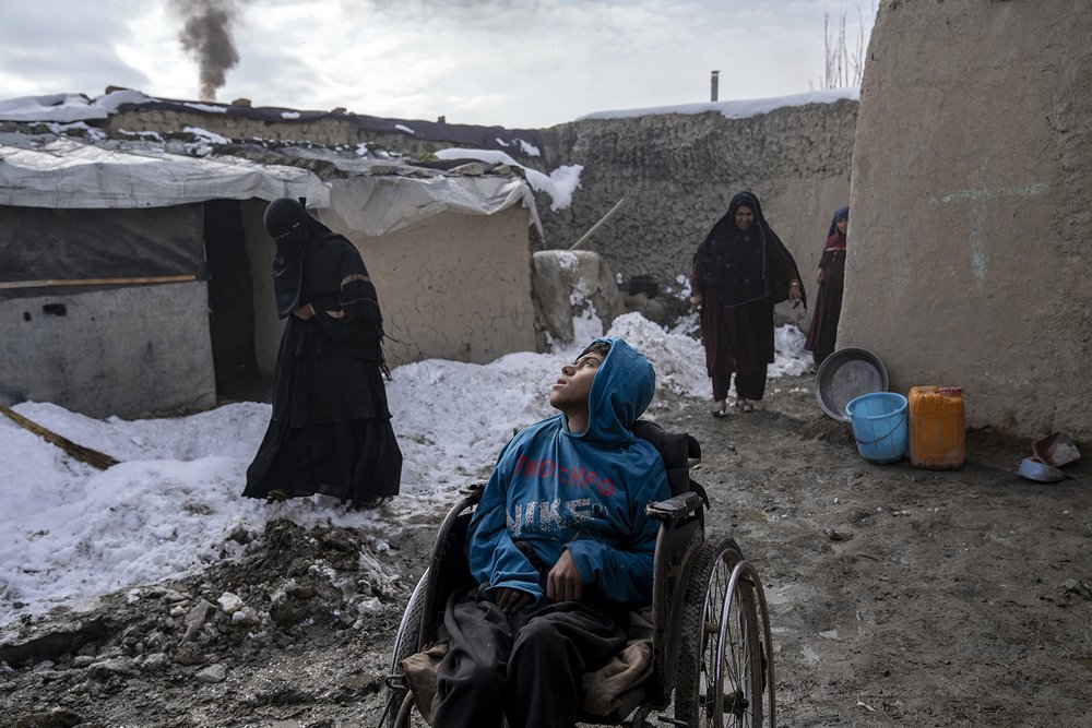  Rahmat, a 15-year-old disabled boy, is placed in the yard to get fresh air in a camp for internally displaced families on the outskirts of Kabul, Afghanistan, Jan 23, 2023.  (AP Photo/Ebrahim Noroozi) 