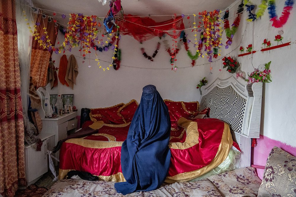  Fahimeh, 14, from an internally displaced family, sits on the bed in the room where she got married, on the outskirts of Kabul, Afghanistan, May 23, 2023. (AP Photo/Ebrahim Noroozi) 
