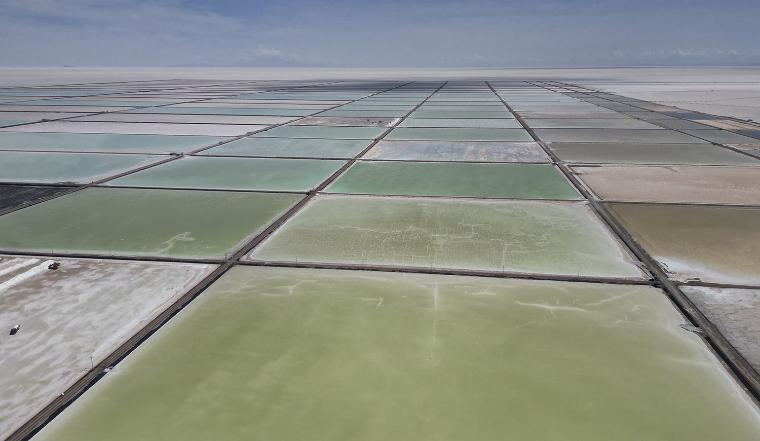  Salt recovery pools stand in different degrees of evaporation for an industrial plant that produces lithium carbonate to manufacture lithium batteries, after the plant's opening ceremony in the Uyuni salt desert on the outskirts of Llipi, Bolivia, D