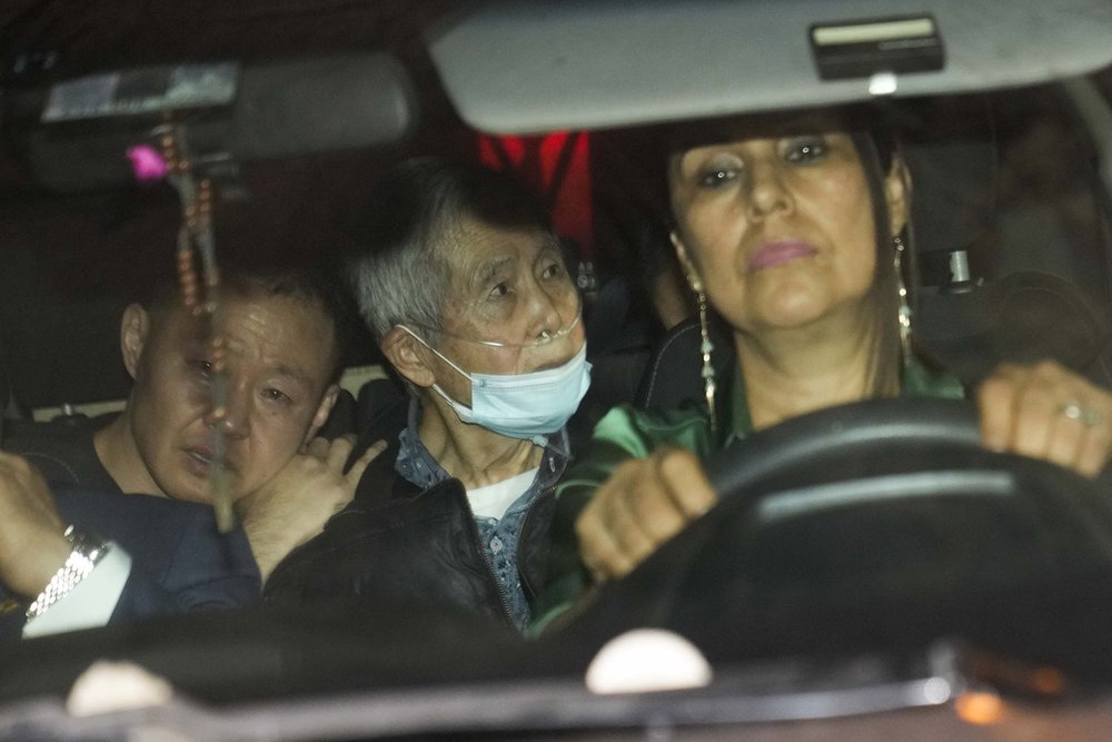  Peru's former President Alberto Fujimori, 85, is driven out of prison by one of his lawyers, accompanied by his son Kenji, left, and daughter Keiko, not seen, after his release in Callao, Peru, Dec. 6, 2023. The country's constitutional court ordere