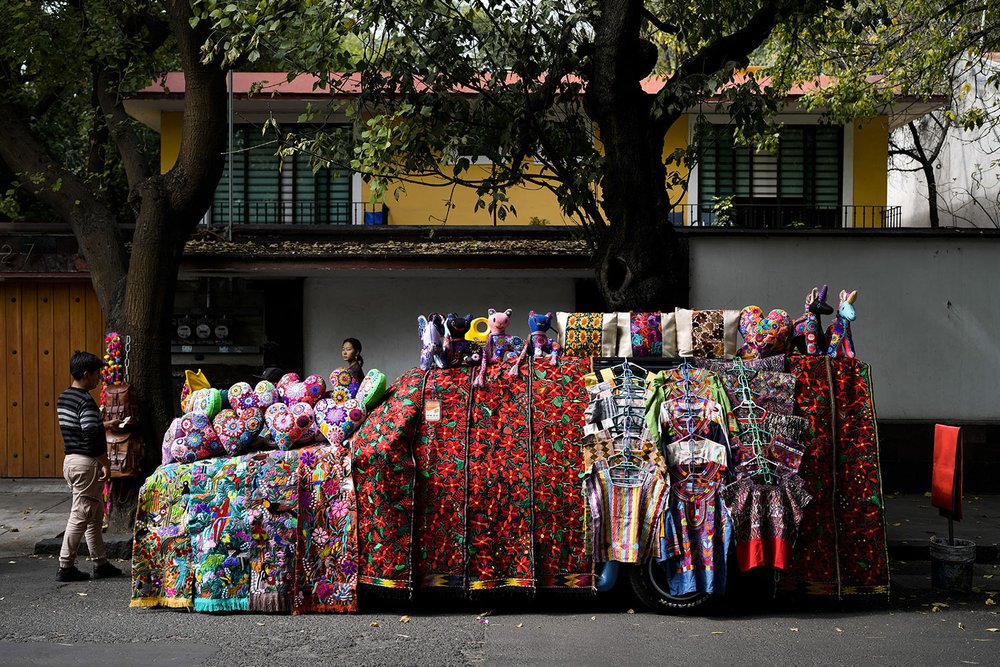  A vendor's car is covered with handicrafts for sale on a street in Mexico City, Dec. 4, 2023. (AP Photo/Eduardo Verdugo) 