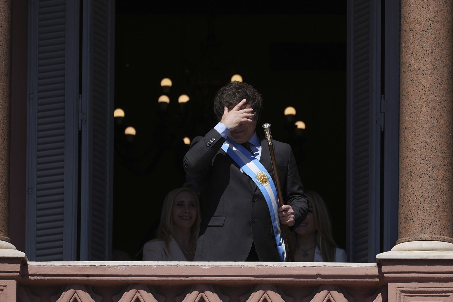  Argentina's newly sworn-in President Javier Milei stands on balcony of the government house before supporters on his inauguration day in Buenos Aires, Argentina, Dec. 10, 2023. (AP Photo/Matilde Campodonico) 