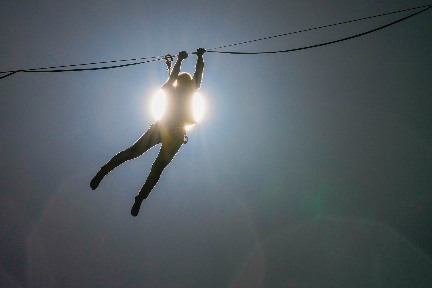  French highliner Nathan Paulin hangs over Bernardo O'Higgins Avenue during his slackline performance in Santiago, Chile, Jan. 3, 2024. (AP Photo/Esteban Felix) 