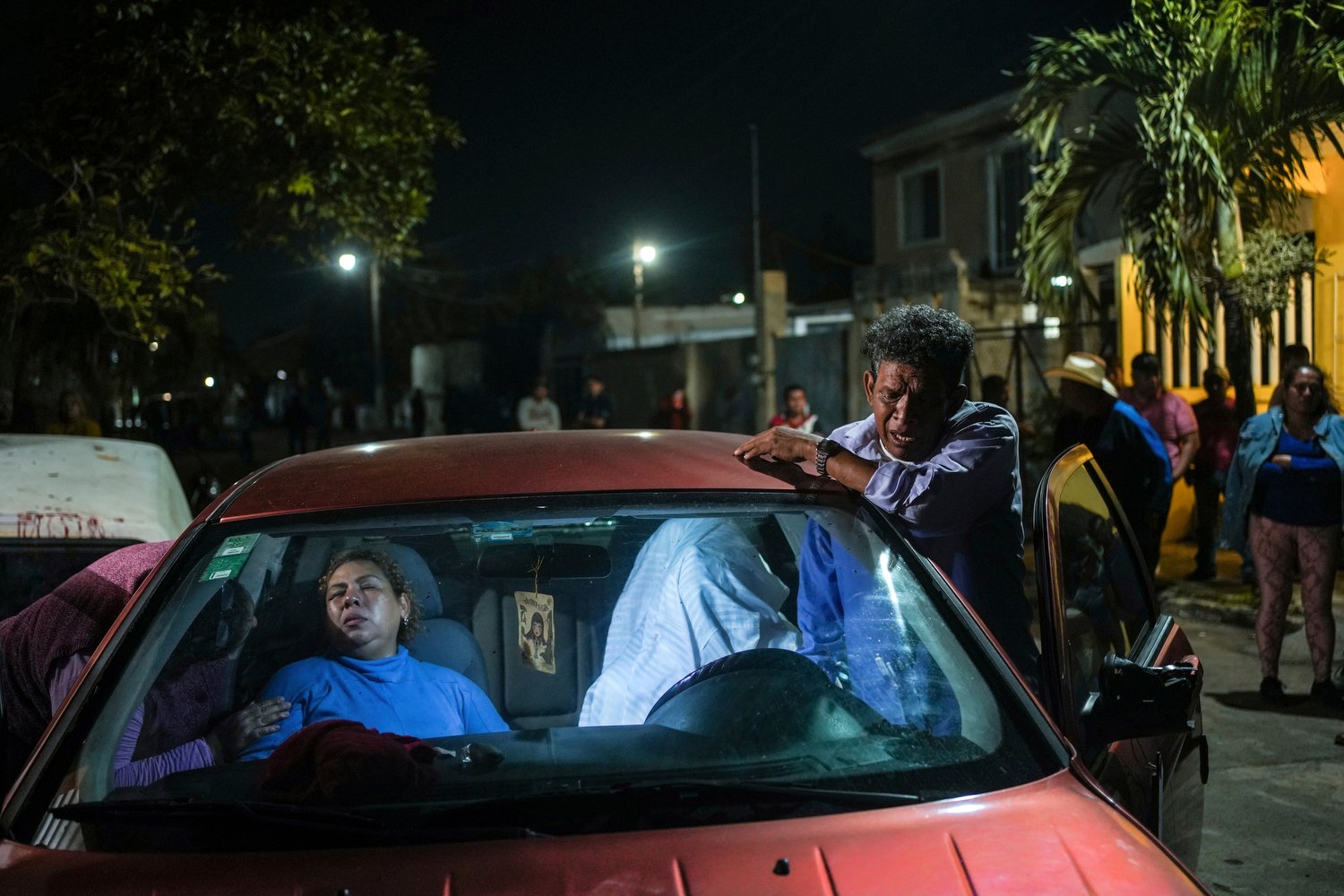  Erika Maria Cruz, left, and her husband, grieve next to the body of their son Brando Arellano Cruz, fatally shot by police after he failed to pull over in Lerdo de Tejada, Mexico, Jan. 19, 2024. Four municipal police officers are under investigation