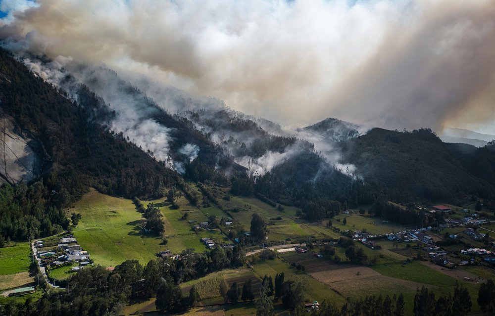  Smoke rises from a fire burning on the slopes of the mountains surrounding Nemocon, north of Bogota, Colombia, Jan. 23, 2024. (AP Photo/Ivan Valencia) 