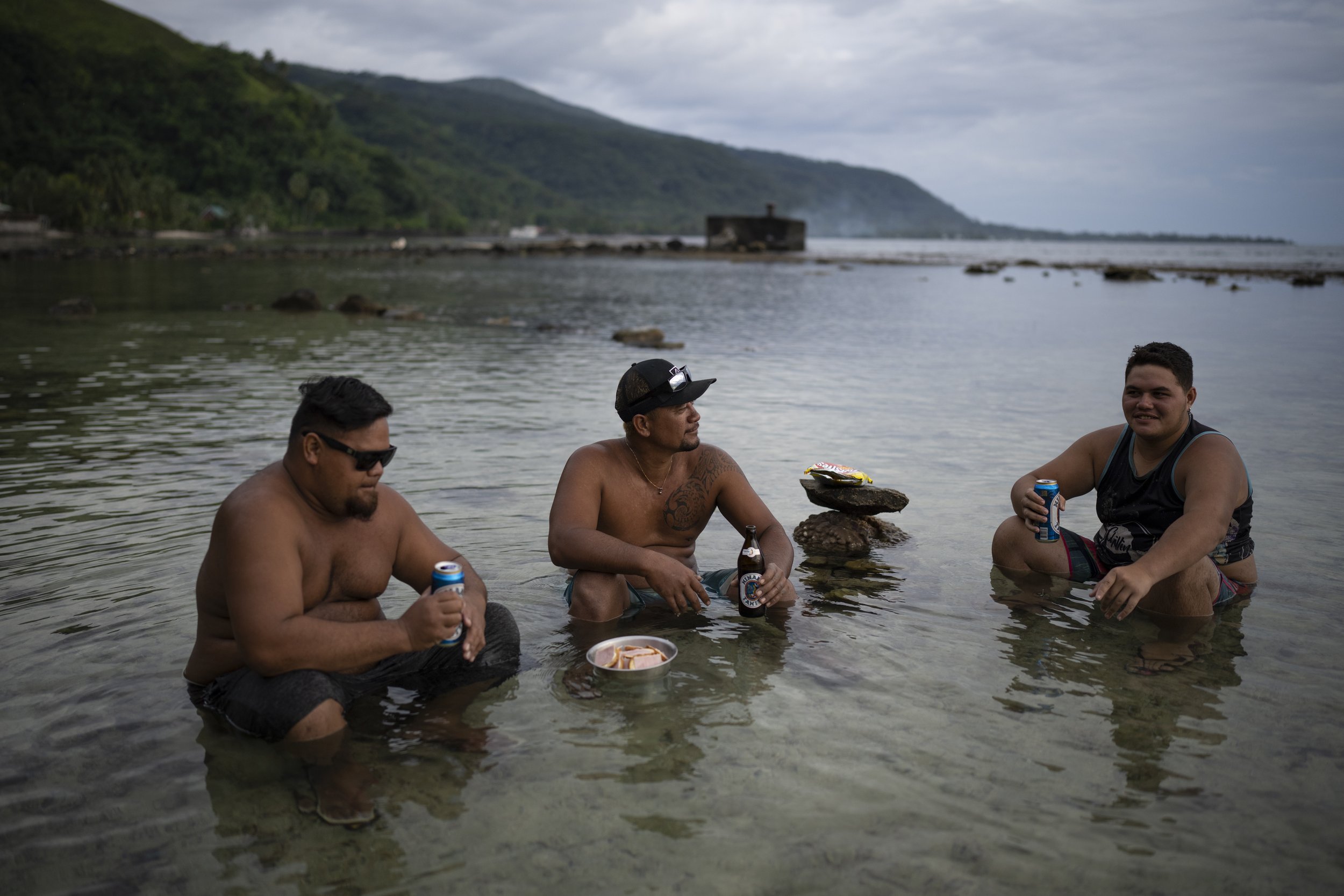  Friends drink together after work in Taiarapu-Ouest, Tahiti, French Polynesia, Friday, Jan. 12, 2024. (AP Photo/Daniel Cole) 