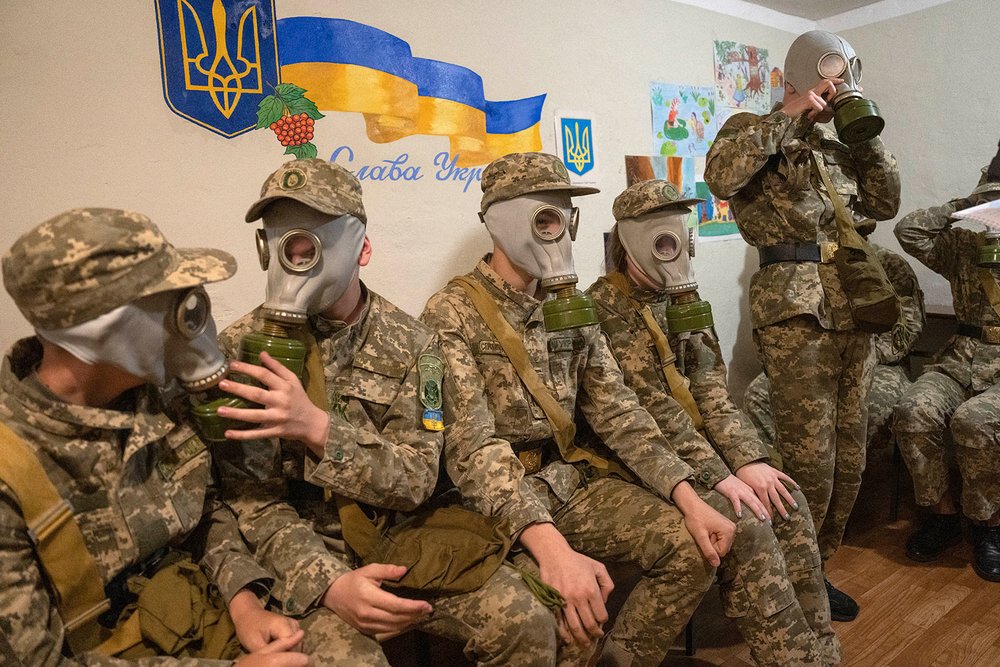  Cadets practice trying on gas masks during a lesson in a bomb shelter in Kyiv, Ukraine, Tuesday, June 6, 2023. (AP Photo/Efrem Lukatsky) 