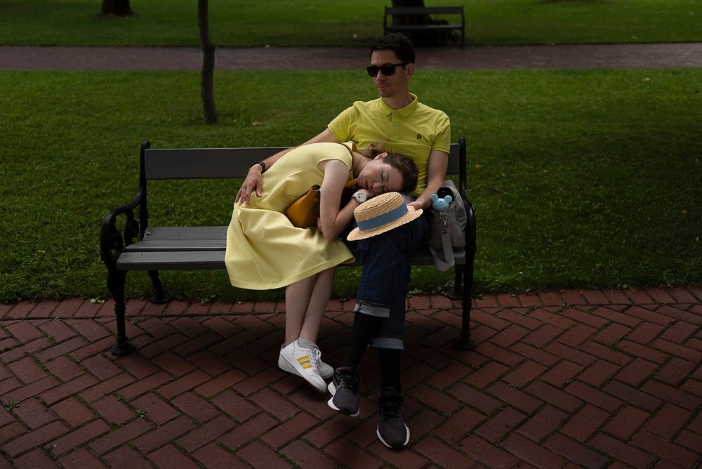  A woman takes a nap on the lap of her husband on a bench at St. Sophia Cathedral in Kyiv, Ukraine, Sunday, July 30, 2023. (AP Photo/Jae C. Hong) 