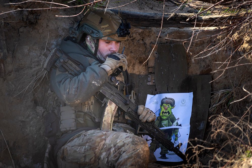  A Ukrainian soldier talks on his radio during combat training in the north of Ukraine, Friday, Nov. 3, 2023.  (AP Photo/Efrem Lukatsky) 