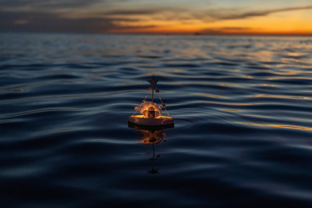  A miniature boat in honor of the African sea goddess Yemanja floats off Ramirez beach in Montevideo, Uruguay, Friday, Feb. 2, 2024. Worshippers visit the beach on Yemanja's feast day, bearing candles, flowers, honey and fruit to honor the deity. (AP