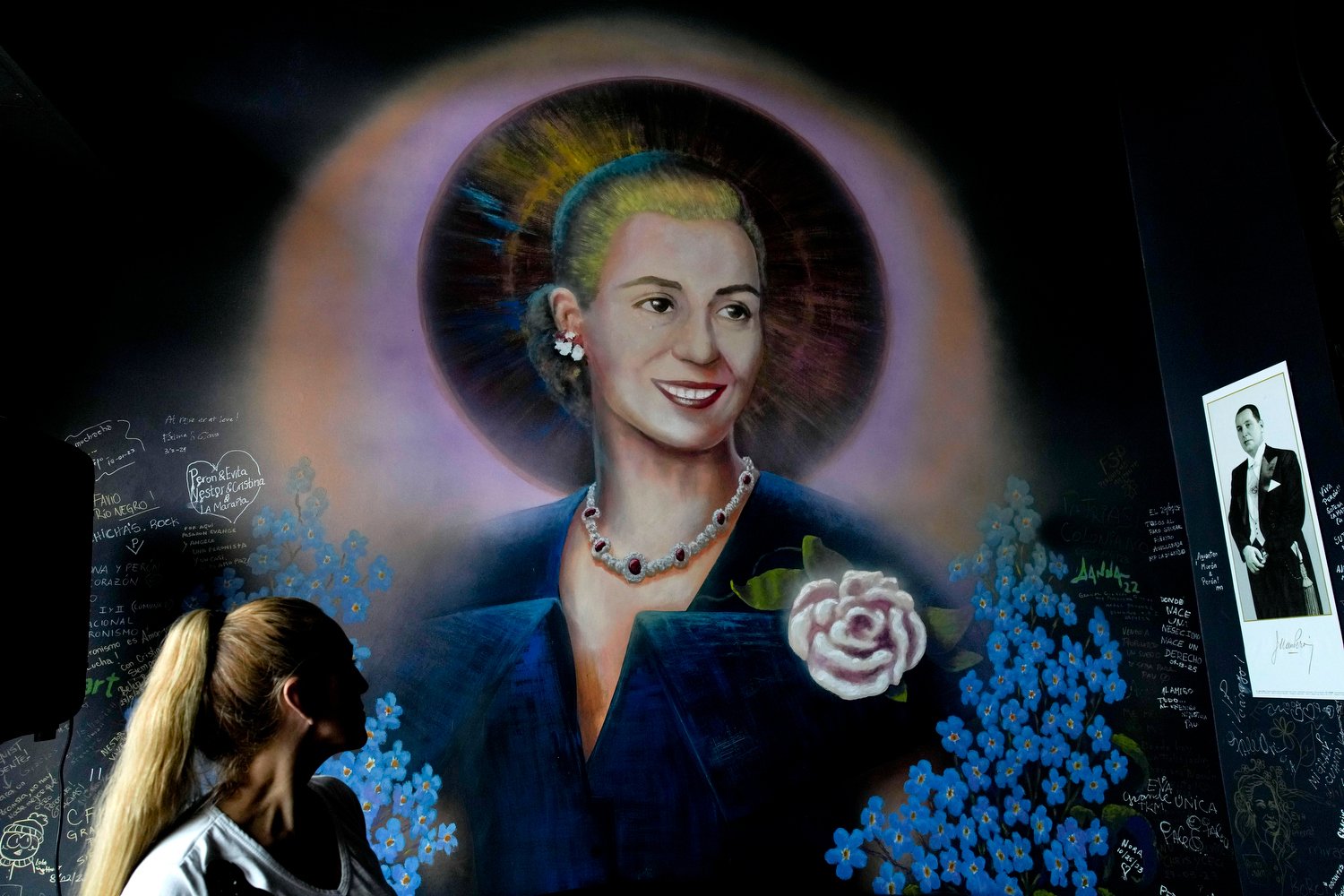  A mural of Argentine former first lady María Eva Duarte de Perón, better known as Eva Perón, or Evita, depicting her with a saint's halo, adorns a wall inside the Peron Peron restaurant in the San Telmo neighborhood of Buenos Aires, Argentina, Frida