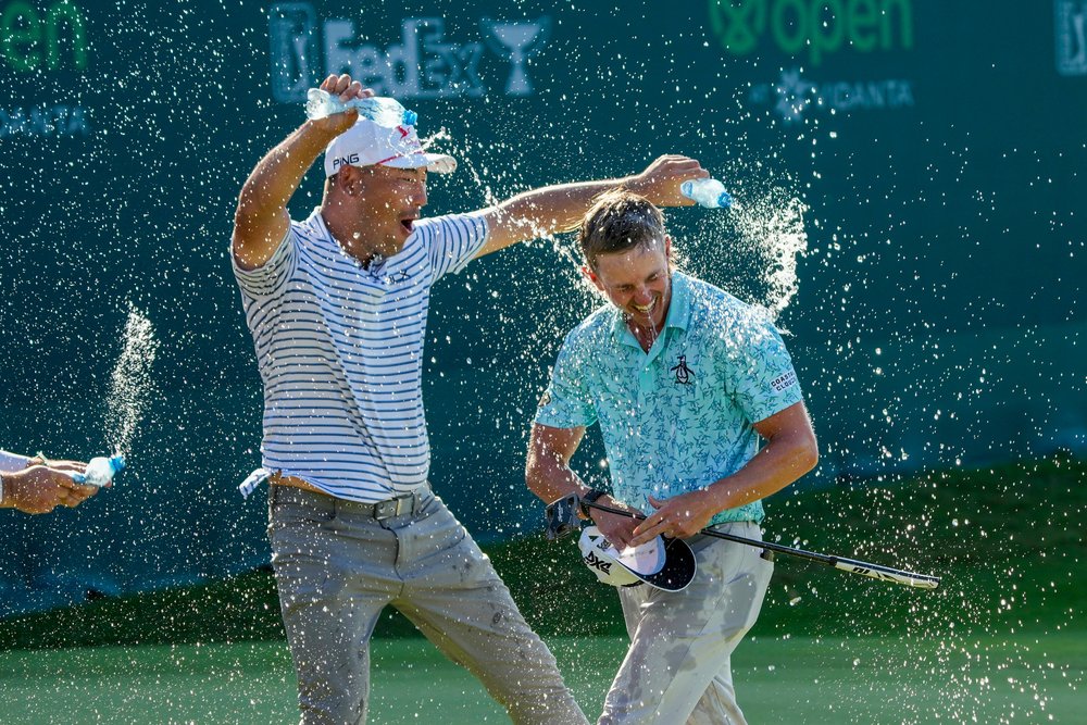  Jake Knapp of the United States is showered with water after winning the Mexico Open golf tournament in Puerto Vallarta, Mexico, Sunday, Feb. 25, 2024. (AP Photo/Fernando Llano) 