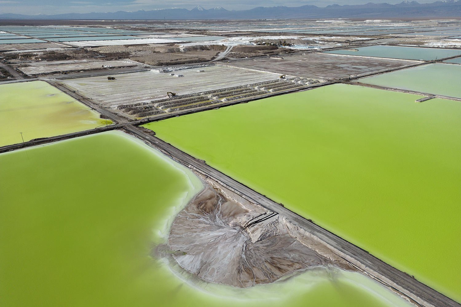  Brine evaporates in pools at the lithium extraction plant facilities of the SQM Lithium company near Peine, Chile, Tuesday, April 18, 2023. In the “lithium triangle” – a region spanning Argentina, Chile and Bolivia – native communities sit upon a tr